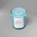 Bougie parfumée artisanale suisse Sakura parfum Bain Moussant, collection Hanami, en verre aux nuances bleutées – fabrication artisanale en Suisse.