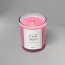 Bougie parfumée artisanale suisse Sakura parfum Fruits Exotiques, collection Hanami, présentée en verre coloré rose – fabrication artisanale en Suisse avec cire naturelle.